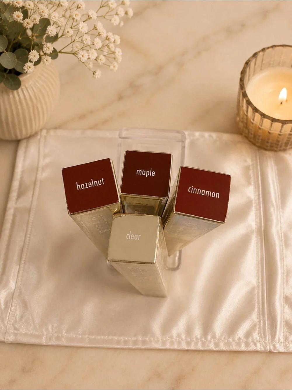 Stila Plumping Lip Glaze tubes in shades Cinnamon,  Hazelnut, Maple, Clear